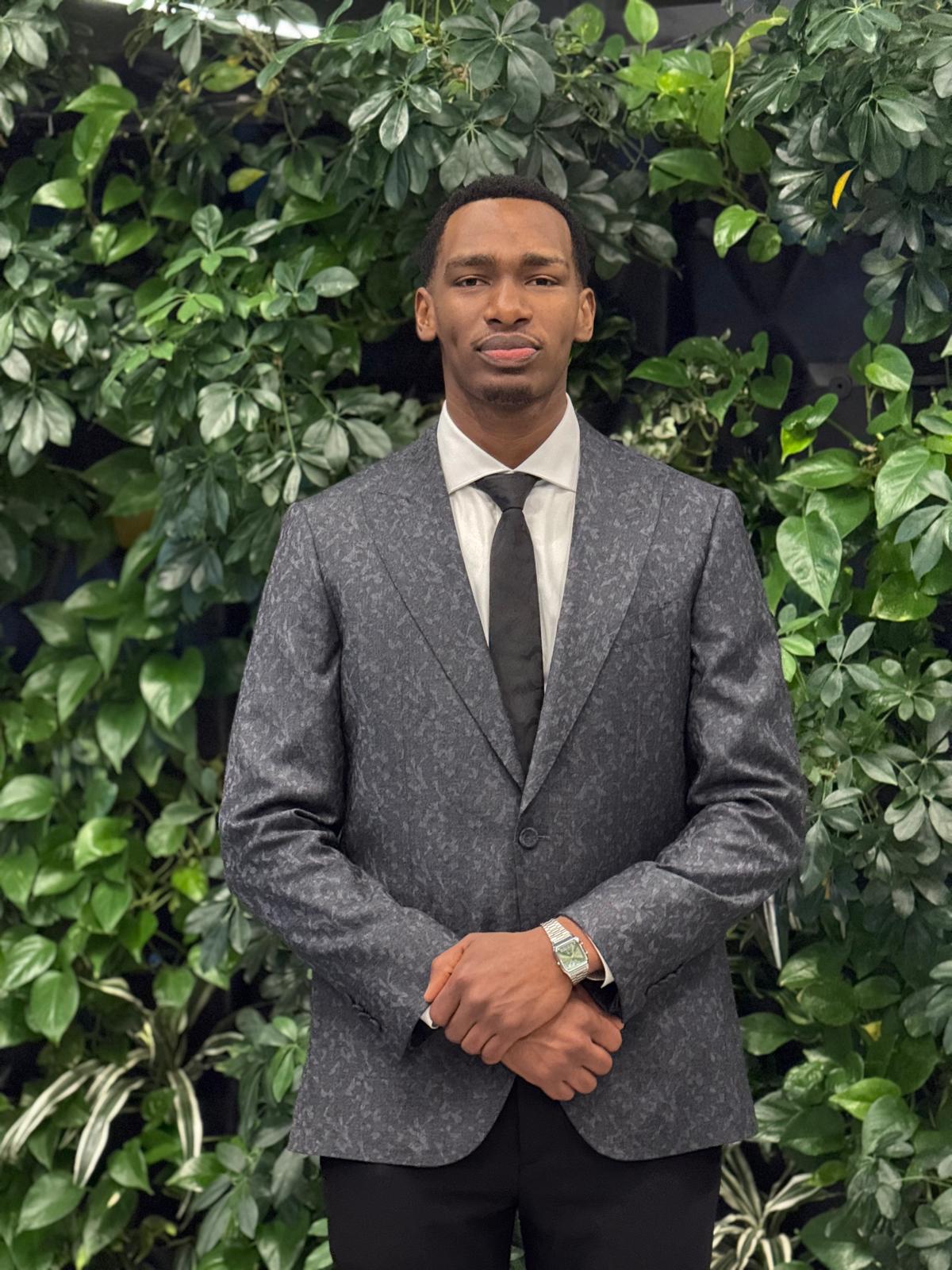 Eric Muganga - Software Engineer, professional headshot showing a confident software developer